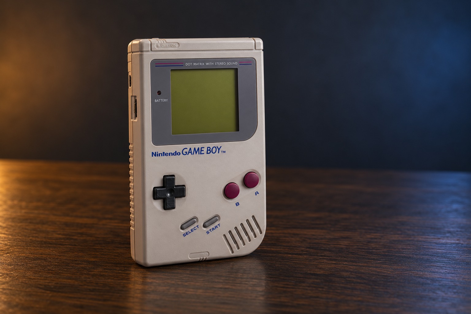 Nintendo Game Boy mit integrierter Steuerung auf einem dunklen Holztisch vor dezent beleuchtetem Hintergrund